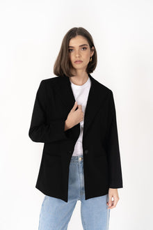 The Cosmo Blazer will instantly add effortless sophistication to any outfit! Lightweight enough to not feel heavy or restrictive but will still provide that extra layer of warmth. We love wearing her with jeans and a white tee for a chic weekend look, or pair with a pant or skirt to create a classic suit for days in the office.

Smart casual blazer with a soft, boxy silhouette.
Small subtle shoulder pads.
Lined collar with fold back lapel.
Lightweight, soft, stretch fabric with beautiful drape.
Functional p