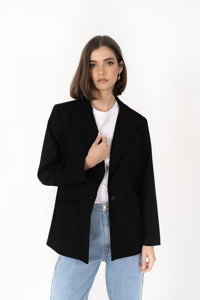 The Cosmo Blazer will instantly add effortless sophistication to any outfit! Lightweight enough to not feel heavy or restrictive but will still provide that extra layer of warmth. We love wearing her with jeans and a white tee for a chic weekend look, or pair with a pant or skirt to create a classic suit for days in the office.

Smart casual blazer with a soft, boxy silhouette.
Small subtle shoulder pads.
Lined collar with fold back lapel.
Lightweight, soft, stretch fabric with beautiful drape.
Functional p