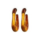 PILGRIM | ELIJAH RECYCLED BROWN EARRINGS - SILVER PLATED

Go with all your heart! The large, oval ELIJAH hoops from Pilgrim, in brown recycled acrylic, introduce an edgy retro vibe to your favourite AW styles. Perfect for those looking for a street-ready accessory and who cherish a classic urban look! Style the earrings with a chunky jumper and an oversized blazer for a laid-back elegance that transitions effortlessly from day-to-night