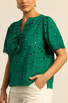 ZOE KRATZMANN | VANTAGE TOP
crafted in 100% cotton, the vantage top is elevated with all-over broderie and contrasting lace trims. a round neckline is framed with lace ruffles and softens the silhouette, while side splits add ease to the fit. feminine and versatile, it’s a piece designed for effortless seasonal styling.
100% cotton
all-over broderie with contrasting lace trims
round neckline finished with gathered scalloped lace
side splits for comfort and wearability