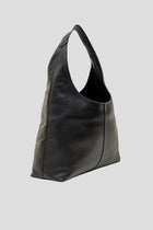 Alēo | LOLA &nbsp;SHOULDER BAG
Large hobo style shoulder bag featuring a spacious interior.
Internal compartments and comfortable wide shoulder strap.
Internal foil embossed signature.
Calf suede leather.

Dimensions
Height: 50 cm
Width: 35.5 cm
Depth: 13 cm

Designed in Ireland.