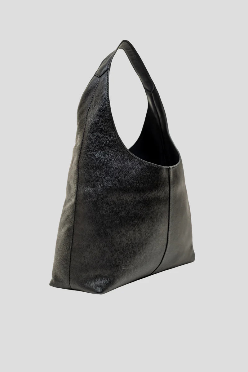 Alēo | LOLA &nbsp;SHOULDER BAG
Large hobo style shoulder bag featuring a spacious interior.
Internal compartments and comfortable wide shoulder strap.
Internal foil embossed signature.
Calf suede leather.

Dimensions
Height: 50 cm
Width: 35.5 cm
Depth: 13 cm

Designed in Ireland.