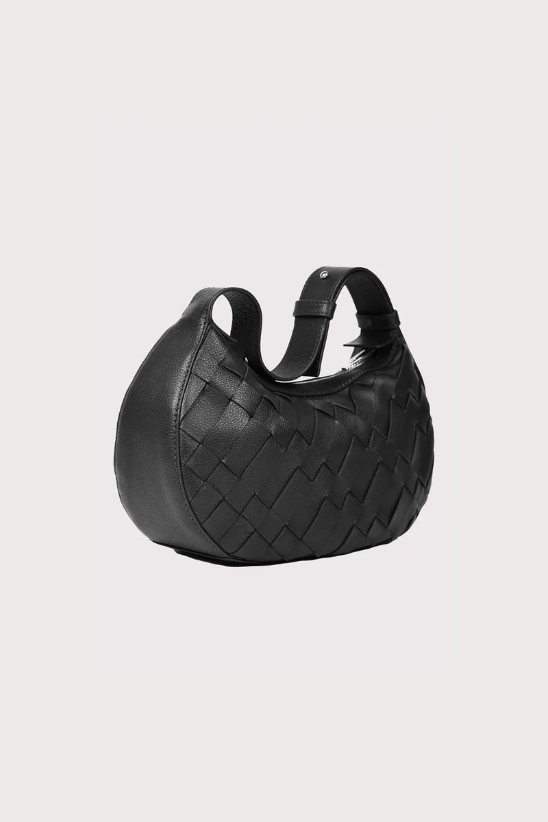 Alēo | SIENNA MINI SHOULDER BAG

Handwoven in soft pebble-grained calf leather, this mini shoulder bag blends artisanal detail with everyday ease. The adjustable strap offers versatile styling, while external and internal zip closures keep your essentials secure.

Soft handwoven box weave mini shoulder bag with adjustable strap options
Single external zip closure with internal zip closure

Dimensions
Height: 18 cm
Width: 31 cm
Depth: 10 cm

Designed in Ireland.