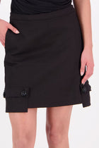 The N-E-S Demi Skirt is a fresh take on utilitarian style, reimagined as a flattering mini. Designed with a curved waistband for a versatile fit across body shapes, it features side seam pockets, a concealed centre back zip, and bold hem pocket detailing with Black buttons. Falling just above the knee, it’s the perfect mix of function and style.

Our model is 174cm and wear a XS (8)

Composition: cotton, spandex&nbsp;

Designed and Made in New Zealand