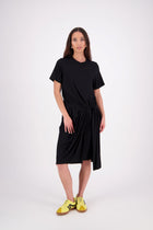 An easy-wear summer staple, 
the N-E-S Ava Knit Dress features a twist pull-through front detail creating a soft, half-moon shape and a subtle asymmetric hem. Designed in a breathable knit with short sleeves and a flattering knee-length cut, it’s the effortless throw-on dress you'll reach for time and time again. Just add slides or sneakers.

Our model is 174cm and wear a XS.

Composition: viscose spandex

Designed and Made in New Zealand
