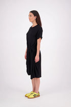 An easy-wear summer staple,
 the N-E-S Ava Knit Dress features a twist pull-through front detail creating a soft, half-moon shape and a subtle asymmetric hem. Designed in a breathable knit with short sleeves and a flattering knee-length cut, it’s the effortless throw-on dress you'll reach for time and time again. Just add slides or sneakers.

Our model is 174cm and wear a XS.

Composition: viscose spandex

Designed and Made in New Zealand