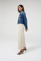 Dricoper Barrie Cream Jean A cropped wide-leg jeans designed mid to high rise. Slightly faded and lightly frayed at the bottom for a vintage appearance. At DRICOPER DENIM, we take pride in our Sustainable Fashion initiative and use eco-friendly materials to create our clothing.