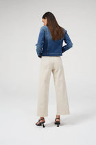 Dricoper Barrie Cream Jean A cropped wide-leg jeans designed mid to high rise. Slightly faded and lightly frayed at the bottom for a vintage appearance. At DRICOPER DENIM, we take pride in our Sustainable Fashion initiative and use eco-friendly materials to create our clothing.