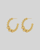 CASTEL & CO
The Bubble Hoops are a playful yet sophisticated take on the classic hoop earring, featuring smooth, rounded details that add texture and dimension to any look. Their gold-plated finish makes them effortlessly versatile, whether you’re dressing up or down.
Main material: gold plating, stainless steel
Closure type: stud
Waterproof and hypoallergenic
Weight: 8g