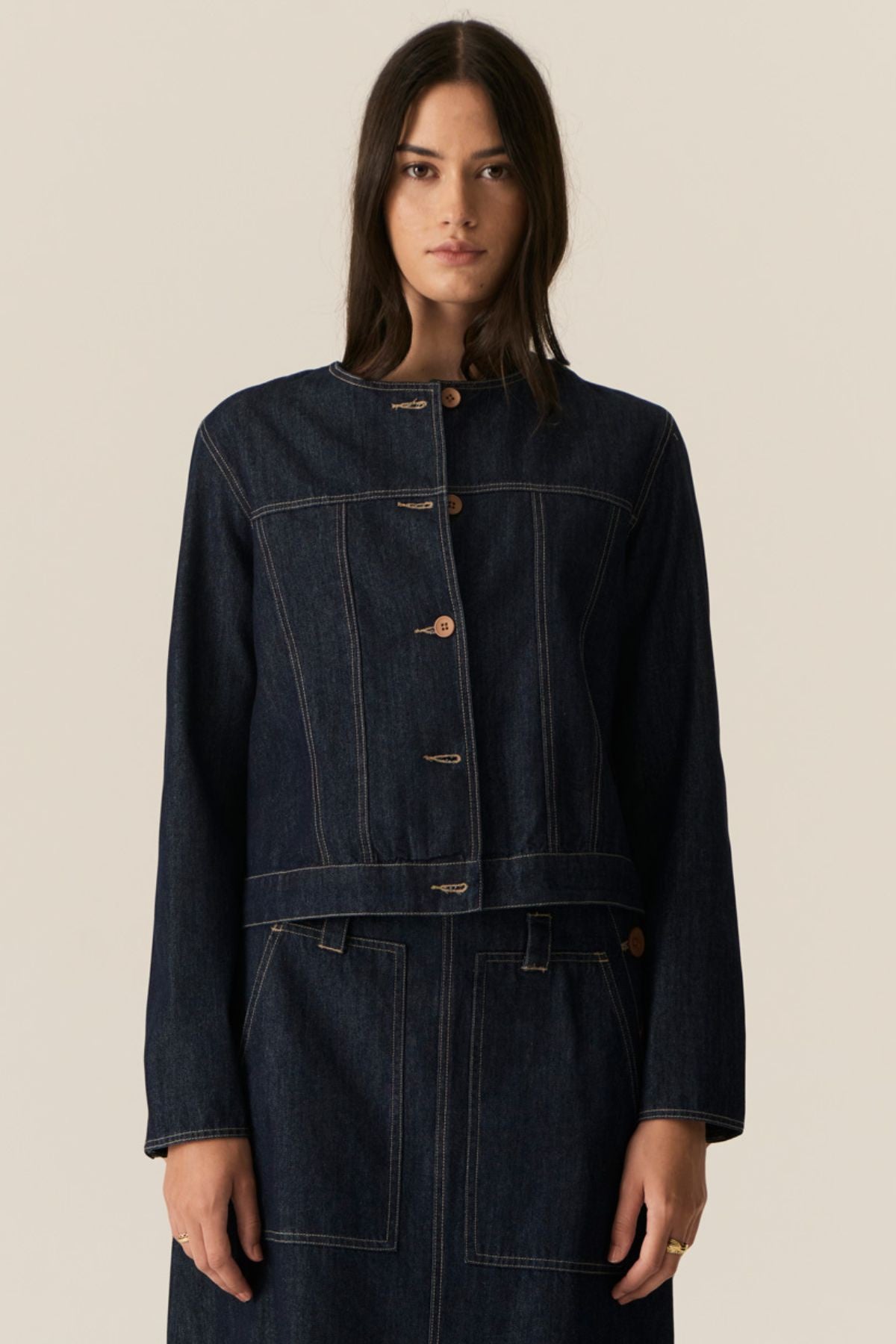 The POL Carsen Denim Jacket is an elevated take on a classic denim jacket. With refined topstitch detailing and a collarless design, we think this just may be the perfect layering piece for Spring.


-Round, collarless neckline.
-Contrast button closure - matches the Carsen Denim skirt and Carsen Pants.
-Full length sleeves - two buttons at the cuff.
-Neater fit through the body.