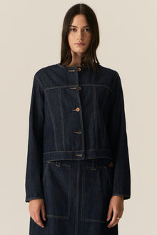 The POL Carsen Denim Jacket is an elevated take on a classic denim jacket. With refined topstitch detailing and a collarless design, we think this just may be the perfect layering piece for Spring.


-Round, collarless neckline.
-Contrast button closure - matches the Carsen Denim skirt and Carsen Pants.
-Full length sleeves - two buttons at the cuff.
-Neater fit through the body.