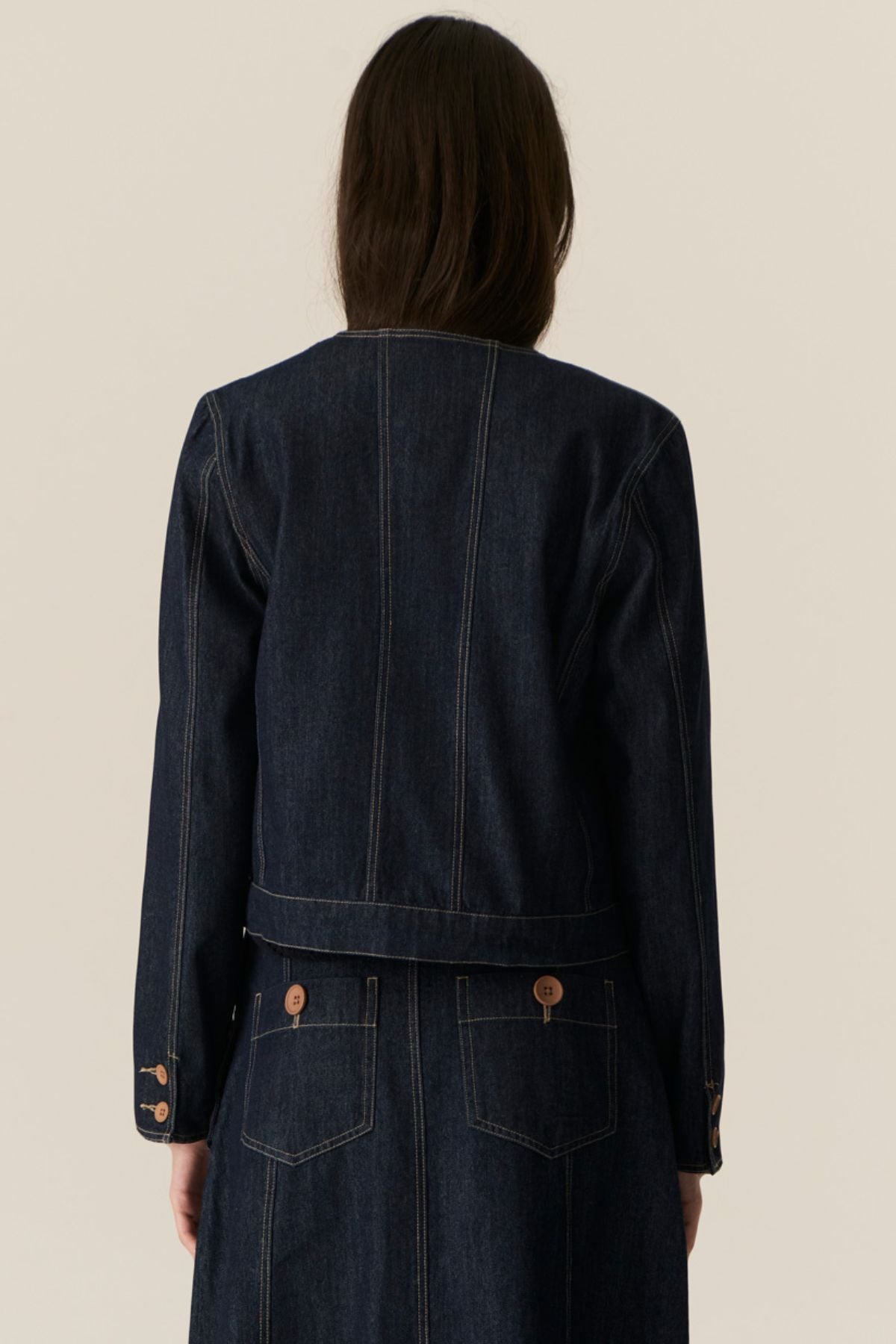 The POL Carsen Denim Jacket is an elevated take on a classic denim jacket. With refined topstitch detailing and a collarless design, we think this just may be the perfect layering piece for Spring.


-Round, collarless neckline.
-Contrast button closure - matches the Carsen Denim skirt and Carsen Pants.
-Full length sleeves - two buttons at the cuff.
-Neater fit through the body.