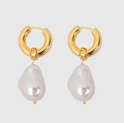 Castel & Co Pearl Earrings - Gold

The Pearl Earrings exude timeless elegance with their delicate, pearl-like drop design. Perfect for adding a touch of sophistication, these earrings effortlessly transition from day to night, making them a versatile accessory for any occasion.

Main material: stainless steel, gold plating, pearl imitation
Closure type: congo.
Earrings size: 5 x 1.5 cm.
Waterproof and hypoallergenic
The plating is long lasting and does not tarnish
Mass: 18 g