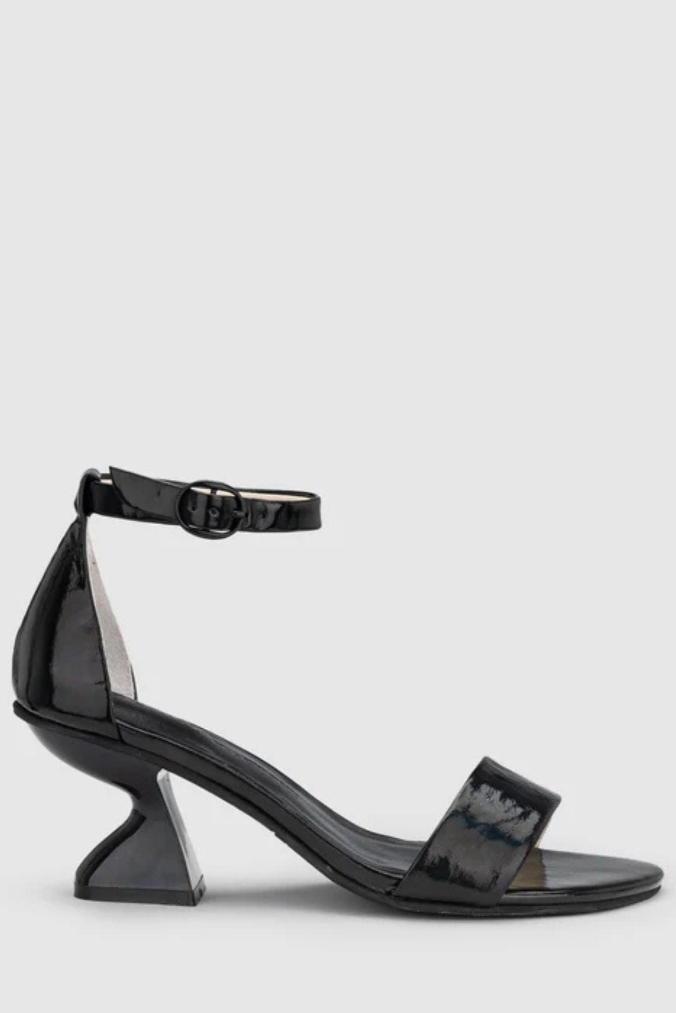 Chaos & Harmony Castel Heel. Black iridescent leather high heel with ankle strap
Soft leather lined
Black iridescent leather covered heel
70mm / 2.8 inch heel
Standard fit