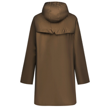 Charlie by Moke lightweight women’s raincoat in Antique Gold, featuring a sleek, streamlined silhouette and soft touch matte TPU finish with 5,000mm waterproof rated fabric, designed for easy layering and everyday wear in light to moderate rain.
