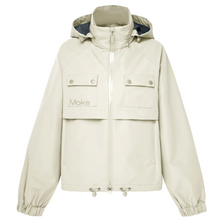 Maggie by Moke women’s short rain jacket with a modern, sporty silhouette. Crafted in a durable matte waterproof fabric with exposed waterproof zip tape for a technical edge. Features a 10,000mm waterproof rating and 5,000g breathability rating for comfortable protection in light to moderate rain. Finished with functional chest pockets and a cinched hem for an adjustable fit. Lightweight, easy to layer, and designed in New Zealand for everyday urban wear.