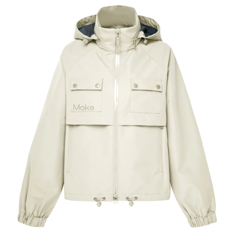 Maggie by Moke women’s short rain jacket with a modern, sporty silhouette. Crafted in a durable matte waterproof fabric with exposed waterproof zip tape for a technical edge. Features a 10,000mm waterproof rating and 5,000g breathability rating for comfortable protection in light to moderate rain. Finished with functional chest pockets and a cinched hem for an adjustable fit. Lightweight, easy to layer, and designed in New Zealand for everyday urban wear.