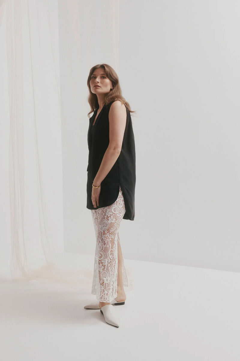 CHAOS &amp; HARMONY | VALOR MULE

Soft and clean, the VALOR MULE in Milk is crafted from recycled leather with a sleek pointed toe. This refined neutral adds a polished touch to everything from workwear to weekend denim.

Milk recycled leather pointed mule
Soft leather lined
Black stack heel / Black rubber outsole
20mm / 0.78 inch heel
Standard fit
We recommend a good leather/suede protectant to protect your shoes
Made in Dongguan, China