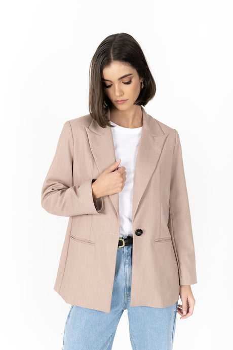 The Cosmo Blazer will instantly add effortless sophistication to any outfit! Lightweight enough to not feel heavy or restrictive but will still provide that extra layer of warmth. We love wearing her with jeans and a white tee for a chic weekend look, or pair with a pant or skirt to create a classic suit for days in the office.

Smart casual blazer with a soft, boxy silhouette.
Small subtle shoulder pads.
Lined collar with fold back lapel.
Lightweight, soft, stretch fabric with beautiful drape.
Functional p