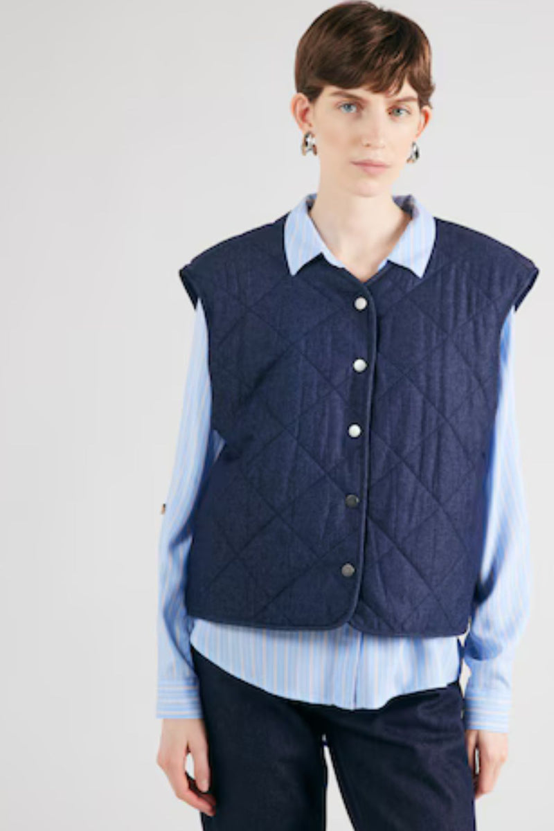 Quilted Vest
Looking for a cute light jacket? Our newest addition to our outerwear collection is here and it's a lightweight MSCH Meika Lysandra cotton vest, in a quilted denim look. It features side pockets, cool front buttons and a round neckline. This can replace a blazer in an indoor outfit or be worn as a spring accessory.

This vest has a boxy fit.

Composition
100% Cotton