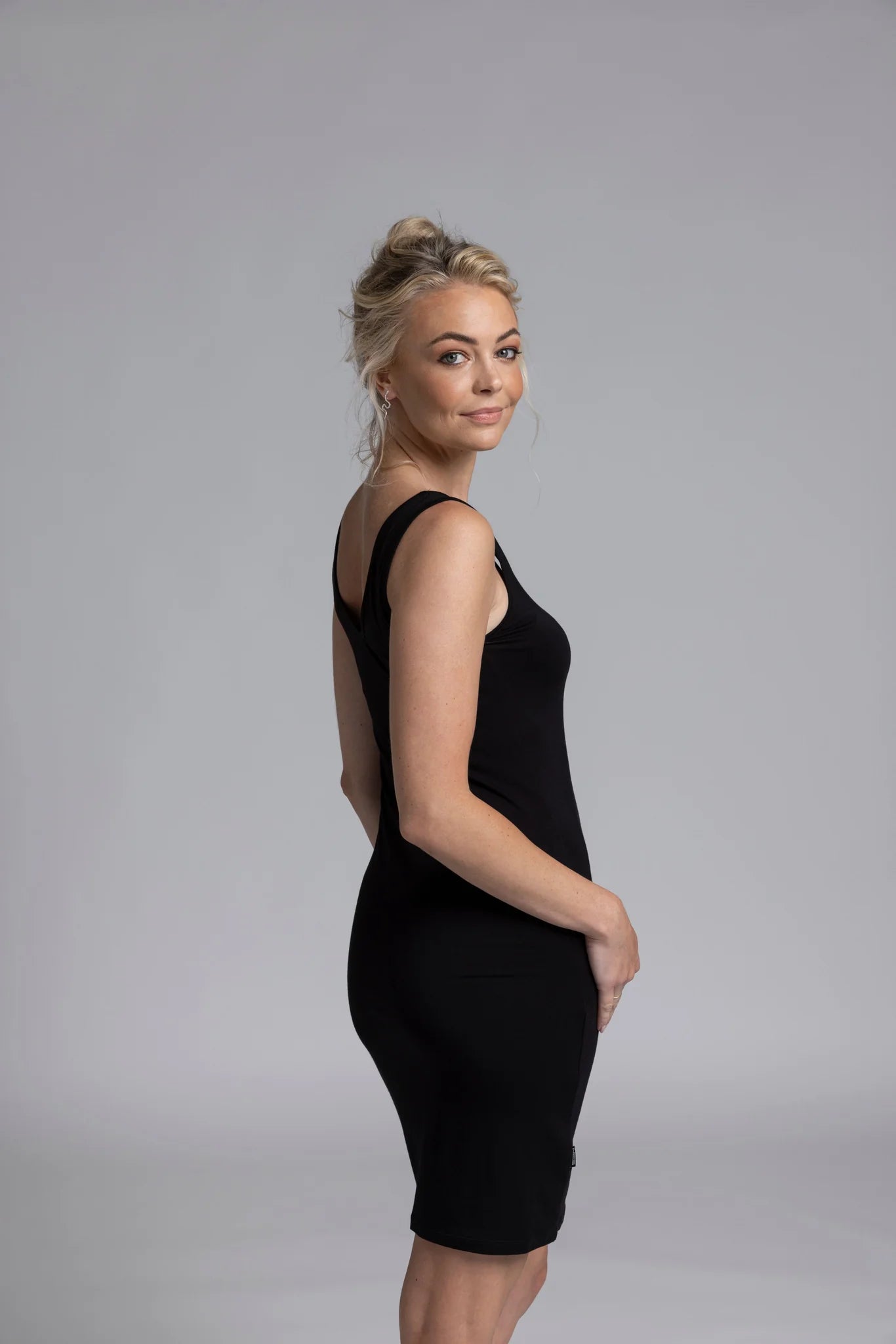 The NES Lattice Slip is a must-have essential for every wardrobe, crafted from a comfortable, non-see-through stretchy knit fabric. This versatile piece can be worn as an undergarment for smooth layering or styled as a top for a chic, effortless look. Featuring fine lattice strap detailing and a reversible design, it offers two stylish options in one. Perfect for layering under dresses, shirts, or jackets,