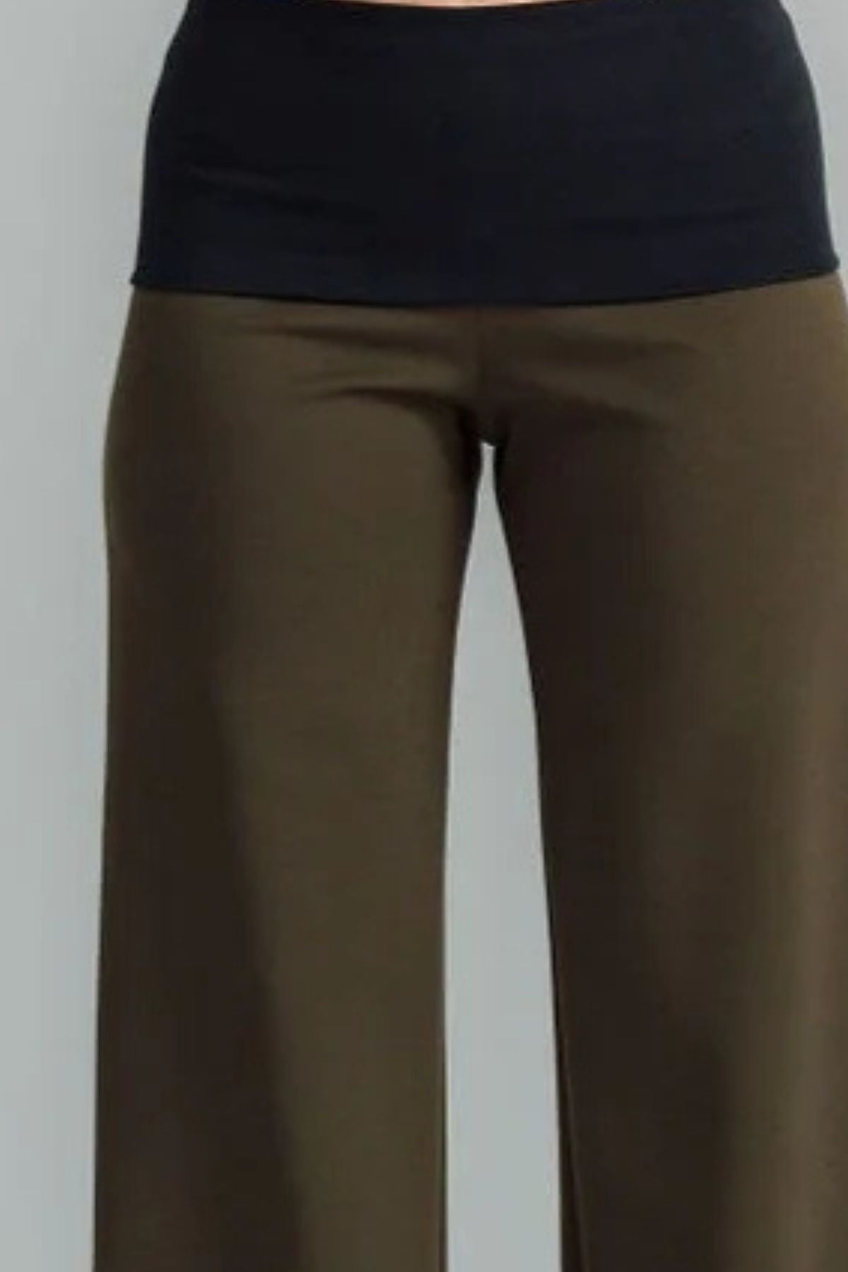 the Famous NES Dolly Bird Pants are back and better than ever! These wide-leg pants feature a versatile fold-down waistband that can be worn up or folded for a customizable fit. Whether you’re dressing up or down, these pants will quickly become your go-to wardrobe staple for years to come. Available in two lengths: