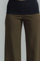the Famous NES Dolly Bird Pants are back and better than ever! These wide-leg pants feature a versatile fold-down waistband that can be worn up or folded for a customizable fit. Whether you’re dressing up or down, these pants will quickly become your go-to wardrobe staple for years to come. Available in two lengths: