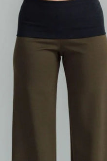 the Famous NES Dolly Bird Pants are back and better than ever! These wide-leg pants feature a versatile fold-down waistband that can be worn up or folded for a customizable fit. Whether you’re dressing up or down, these pants will quickly become your go-to wardrobe staple for years to come. Available in two lengths: