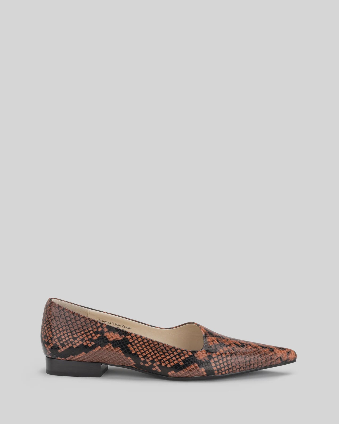 CHAOS &amp; HARMONY | DYNASTY FLAT
The DYNASTY FLAT in Coco Snake is a striking embossed pointed flat in deep chocolate and black tones. With an angled upper and elegant profile, this flat brings texture and edge to both office and off-duty outfits.
Coco snake embossed leather pointed flat
Soft leather lined
Black stack heel / Black rubber outsole
20mm / 0.78 inch heel
Smaller fit - if you are a half size, please size up
