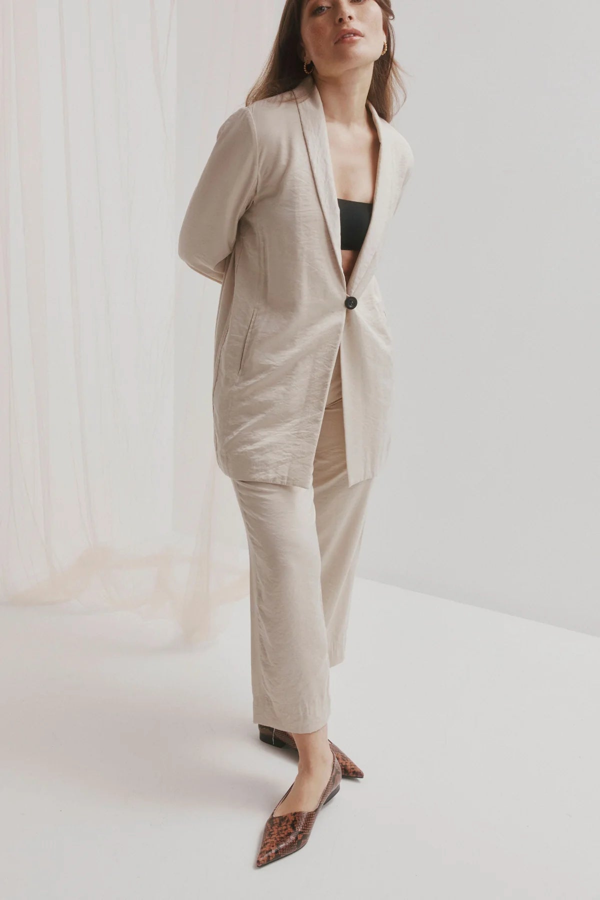 CHAOS &amp; HARMONY | DYNASTY FLAT
The DYNASTY FLAT in Coco Snake is a striking embossed pointed flat in deep chocolate and black tones. With an angled upper and elegant profile, this flat brings texture and edge to both office and off-duty outfits.
Coco snake embossed leather pointed flat
Soft leather lined
Black stack heel / Black rubber outsole
20mm / 0.78 inch heel
Smaller fit - if you are a half size, please size up
