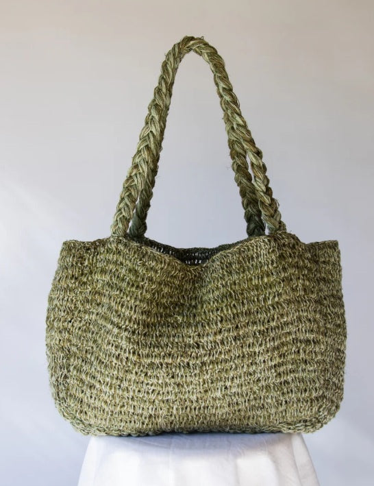 This oversized Hobo and Hatch Elle Grande bag is handwoven in Nepal from a durable hemp and cotton blend. It features chunky plaited shoulder straps for added comfort and is roomy enough for market mornings, beach days, and everything in between.

Details:

- Soft plaited shoulder strap

- Open weave

- Packs flat

- Approximate dimensions: 53cm width x 28cm length x 17cm depth

- Hemp and Cotton blend handmade in Nepal