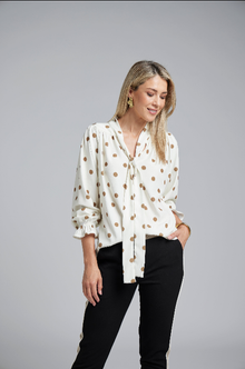 N-E-S Esme Top, designed and made in NZ – a relaxed women’s top with curved front and back hem, finishing just below the waistband; lightweight and breathable, available in Black Polka Dot (100% viscose georgette with butter-yellow mini spots) or Ivory Spot (100% polyester satin-back crepe with bronze oversized spots) for soft drape, gentle movement, and effortless, polished everyday wear.