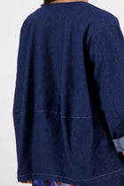 A fresh take on a wardrobe favourite, the NES Denim Echo Jacket now features crisp white topstitching along the hemlines for a modern contrast finish. Crafted in lightweight denim, this relaxed open-front jacket includes practical pockets and a subtle ballooning back panel for added shape. The perfect throw-on layer that effortlessly blends casual cool with elevated edge.