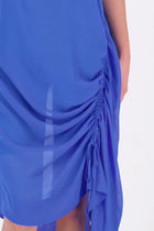 The N-E-S Em Dress is a statement style crafted in lightweight chiffon, designed with ruching and a drawcord that lets you adjust the length to suit your look. Featuring a cap sleeve on the left and a cuffed short sleeve on the right, it embraces asymmetry with a wide cuff hem for added edge. Floaty yet bold, the Em Dress is your go-to for elevated, directional dressing.

Our model is 174cm and wears a XS (8)
NES fit advise: Standard fit

Composition: PT Chiffon

Designed and Made in New Zealand