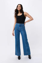 The iconic Kireina Farrah jean that just so happens to be named for the favourite 70’s icon. Cut with a flattering high-rise waist and tapering out to a 70’s inspired wide leg. This flattering AND comfortable jean features a longer leg length, patch pockets and a retro seam. The Farrah is sure to inspire the coolest of LA vibes.

FEATURES:
- High Rise Wide Leg
- Average Inside Leg Length = 82cm
- Patch pockets on front and rear
- 90's Blue
- Zipper fly
