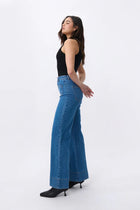 The iconic Kireina Farrah jean that just so happens to be named for the favourite 70’s icon. Cut with a flattering high-rise waist and tapering out to a 70’s inspired wide leg. This flattering AND comfortable jean features a longer leg length, patch pockets and a retro seam. The Farrah is sure to inspire the coolest of LA vibes.

FEATURES:
- High Rise Wide Leg
- Average Inside Leg Length = 82cm
- Patch pockets on front and rear
- 90's Blue
- Zipper fly