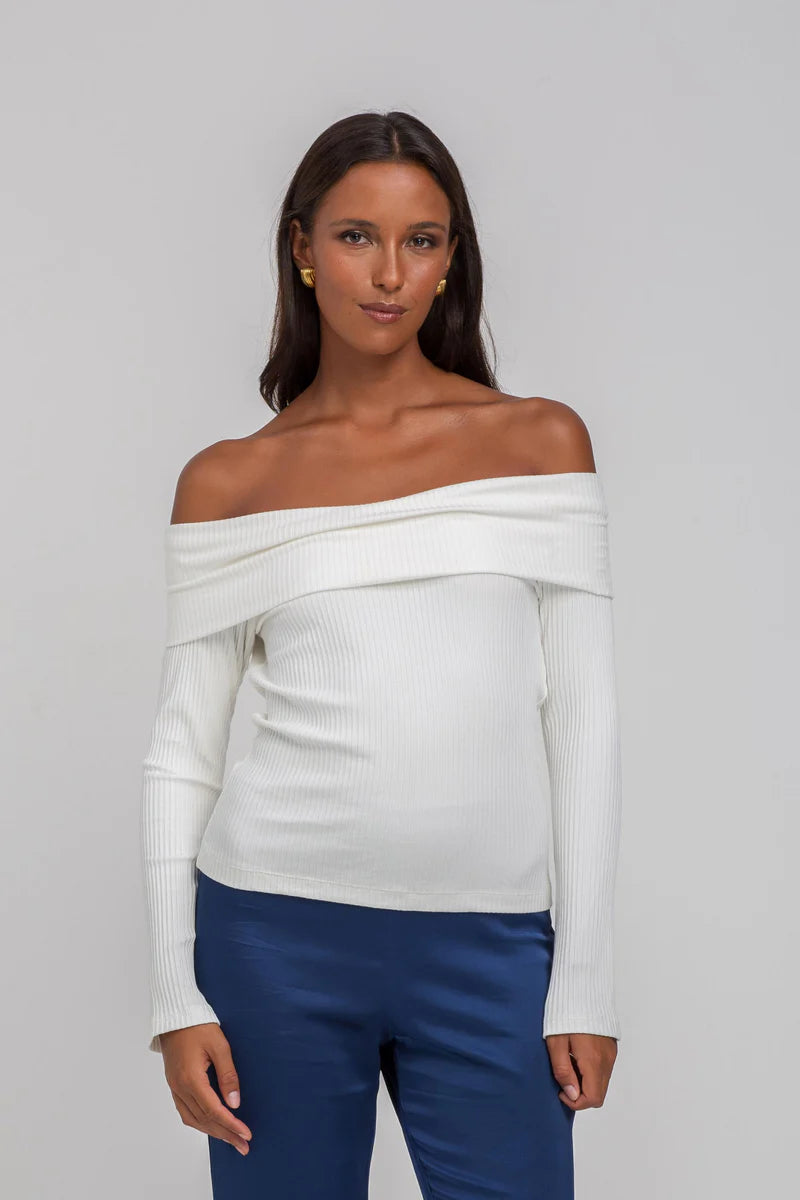 BLAK LOVE

Indulge in the Ivory Feeling Lucky Top, crafted with ecovero viscose rib for a form-fitting look. The off-the-shoulder design features a fold-down Bardot neckline and long sleeves for a sophisticated touch. The straight hem falls at the high hip, creating an elegant and exclusive silhouette.

Fabric composition - Ecovero Viscose Rib

Fit - True to size / form fitting

Off the shoulder, fold down Bardot neckline
Long sleeves
Straight hem finishes at high hip
Our model is&nbsp; wearing size 8.