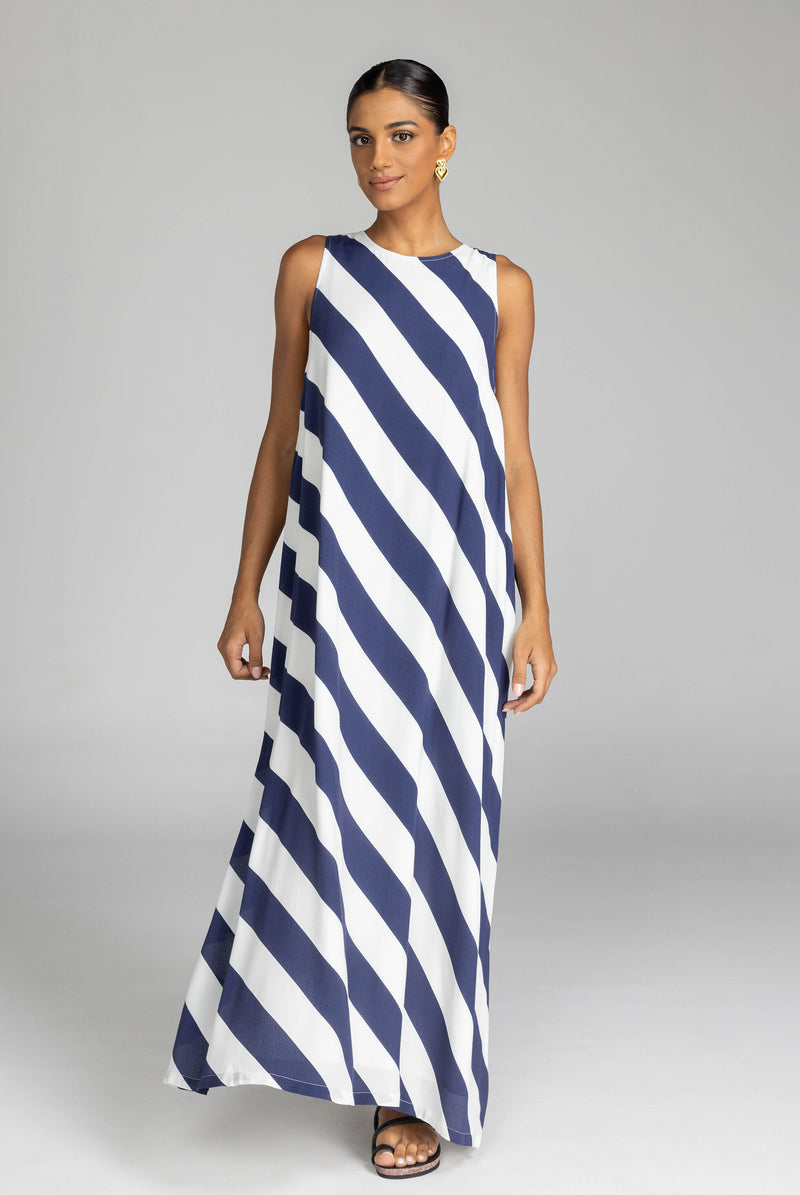 The distinguished BLAK Finally Here Stripe Dress presents our signature silhouette in premium rayon viscose with an elegant navy and white diagonal stripe pattern, featuring a refined high neckline and sleeveless construction. Thoughtful details include a discreet back keyhole with button closure and precise side splits, creating a versatile silhouette that accommodates diverse body types with sophisticated ease.

Fabric composition - Rayon viscose