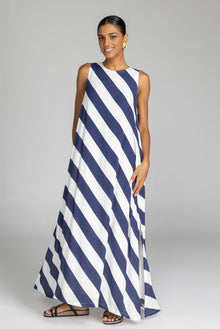 The distinguished BLAK Finally Here Stripe Dress presents our signature silhouette in premium rayon viscose with an elegant navy and white diagonal stripe pattern, featuring a refined high neckline and sleeveless construction. Thoughtful details include a discreet back keyhole with button closure and precise side splits, creating a versatile silhouette that accommodates diverse body types with sophisticated ease.

Fabric composition - Rayon viscose
