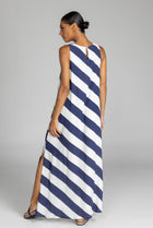 The distinguished BLAK Finally Here Stripe Dress presents our signature silhouette in premium rayon viscose with an elegant navy and white diagonal stripe pattern, featuring a refined high neckline and sleeveless construction. Thoughtful details include a discreet back keyhole with button closure and precise side splits, creating a versatile silhouette that accommodates diverse body types with sophisticated ease.

Fabric composition - Rayon viscose