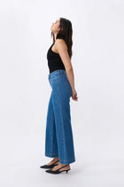 Channel chic 70’s style. A modern twist on the classic wide-legged jean, the Kireina Freya Jean features a mid/high rise that’s fitted at the hips with a relaxed, wide leg that flares at the knee. Works so well with one of our classic cotton tees and a pair of boots or sandals.