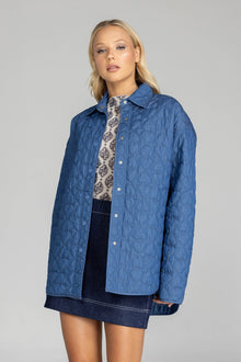 Meet the Blak Frozen Embrace Jacket in denim blue, a premium piece featuring distinctive heart quilting that instantly elevates your style. Crafted from quality cotton with a flattering relaxed fit and convenient dome closures. The trendy drop shoulders and hidden pockets add both fashion appeal and functionality. Expertly finished with bound edges and a curved hem—this versatile essential works for any occasion, making it your smartest wardrobe investment this season.

Fabric composition - Quilted Poly