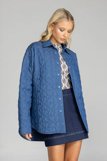 Meet the Blak Frozen Embrace Jacket in denim blue, a premium piece featuring distinctive heart quilting that instantly elevates your style. Crafted from quality cotton with a flattering relaxed fit and convenient dome closures. The trendy drop shoulders and hidden pockets add both fashion appeal and functionality. Expertly finished with bound edges and a curved hem—this versatile essential works for any occasion, making it your smartest wardrobe investment this season.

Fabric composition - Quilted Poly