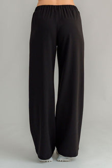 The NES Ginnie Pant is a stylish update to our top-selling Gin Pants, now featuring a pin stitch pleat down the front legs for an elongated, flattering silhouette. With a classic cut that’s easy to dress up or down, these pants are perfect for both work and everyday wear. The centre leg pin stitch detailing adds a touch of sophistication, while the flat front and covered elasticated back provide a comfortable, secure fit. The flattering angled panel at the front enhances the shape, and the full-length strai