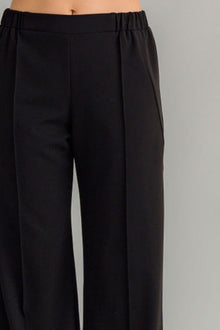 The NES Ginnie Pant is a stylish update to our top-selling Gin Pants, now featuring a pin stitch pleat down the front legs for an elongated, flattering silhouette. With a classic cut that’s easy to dress up or down, these pants are perfect for both work and everyday wear. The centre leg pin stitch detailing adds a touch of sophistication, while the flat front and covered elasticated back provide a comfortable, secure fit. The flattering angled panel at the front enhances the shape, and the full-length strai