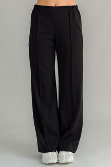 The NES Ginnie Pant is a stylish update to our top-selling Gin Pants, now featuring a pin stitch pleat down the front legs for an elongated, flattering silhouette. With a classic cut that’s easy to dress up or down, these pants are perfect for both work and everyday wear. The centre leg pin stitch detailing adds a touch of sophistication, while the flat front and covered elasticated back provide a comfortable, secure fit. The flattering angled panel at the front enhances the shape, and the full-length strai