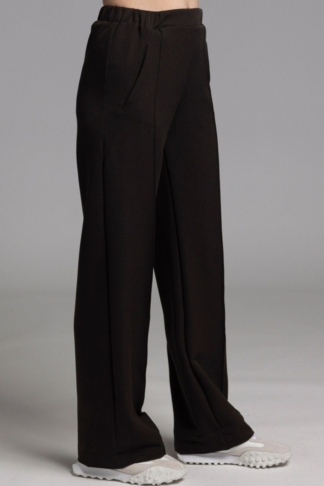 The NES Ginnie Pant is a stylish update to our top-selling Gin Pants, now featuring a pin stitch pleat down the front legs for an elongated, flattering silhouette. With a classic cut that’s easy to dress up or down, these pants are perfect for both work and everyday wear. The centre leg pin stitch detailing adds a touch of sophistication, while the flat front and covered elasticated back provide a comfortable, secure fit. The flattering angled panel at the front enhances the shape, and the full-length strai