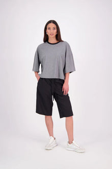 The N-E-S Rita Short is an easy update to our classic Gin Short, crafted in a breathable linen-cotton blend. Featuring a single front leg pleat for subtle shape, angled front pockets, and an elasticated back waistband for comfort. A decorative front drawcord adds detail, with a length finishing just below the knee—perfect for relaxed yet polished summer dressing.

White colourway has a 1/2 liner in a cotton voile
Our model is 174cm and wear a XS (8)
Composition: Linen Cotton
Designed and Made in New Zealand