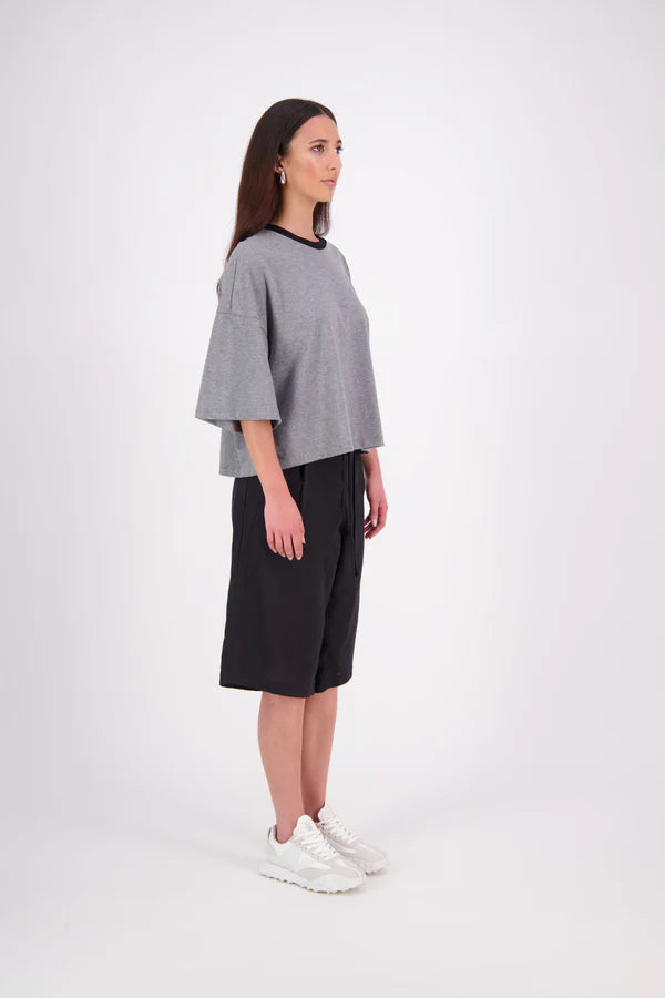 The N-E-S Rita Short is an easy update to our classic Gin Short, crafted in a breathable linen-cotton blend. Featuring a single front leg pleat for subtle shape, angled front pockets, and an elasticated back waistband for comfort. A decorative front drawcord adds detail, with a length finishing just below the knee—perfect for relaxed yet polished summer dressing.

White colourway has a 1/2 liner in a cotton voile
Our model is 174cm and wear a XS (8)
Composition: Linen Cotton
Designed and Made in New Zealand