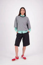 The N-E-S Rita Short is an easy update to our classic Gin Short, crafted in a breathable linen-cotton blend. Featuring a single front leg pleat for subtle shape, angled front pockets, and an elasticated back waistband for comfort. A decorative front drawcord adds detail, with a length finishing just below the knee—perfect for relaxed yet polished summer dressing.

White colourway has a 1/2 liner in a cotton voile
Our model is 174cm and wear a XS (8)
Composition: Linen Cotton
Designed and Made in New Zealand